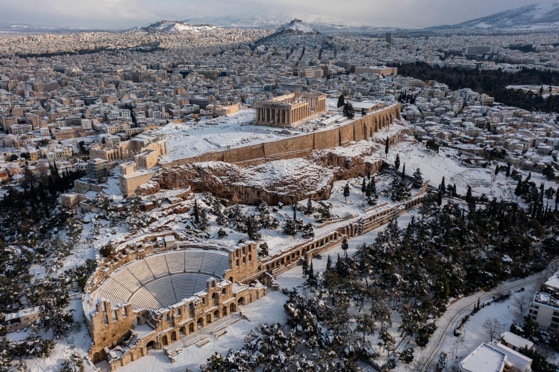 The snow-covered Ancient Temple of Parthenon atop the Acropolis.