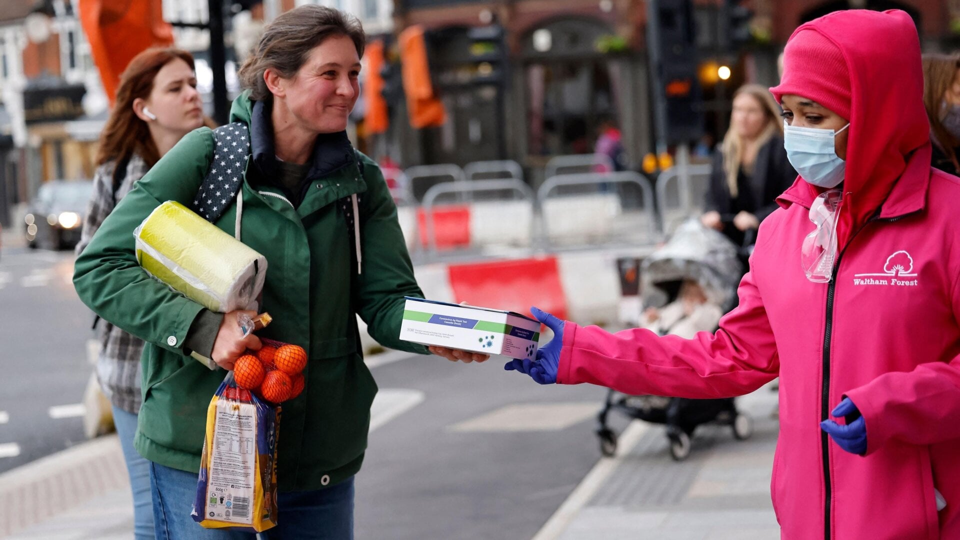 Free covid-19 tests are handed out in northeast London on January 3, 2022.