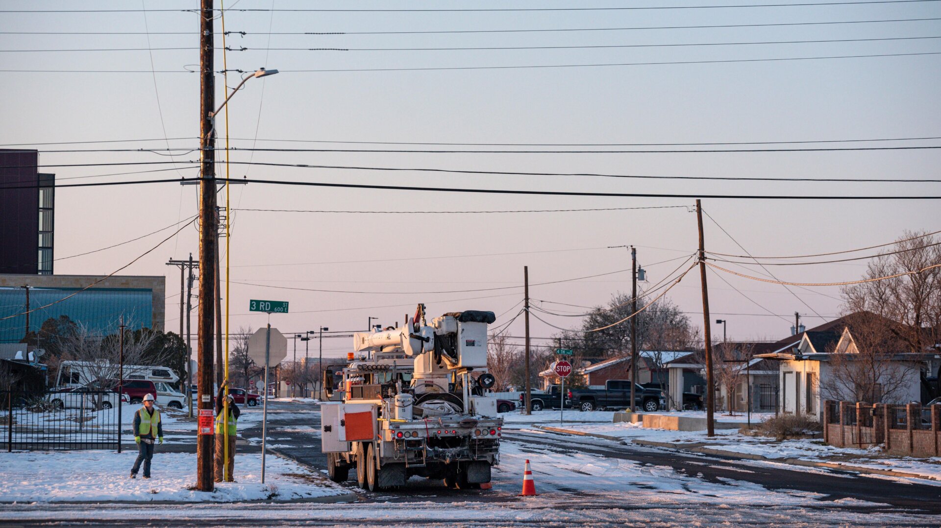 An Oncor Electric Delivery crew works on restoring power to a neighborhood following the winter storm that passed through Texas Thursday, Feb. 18, 2021, in Odessa, Texas.