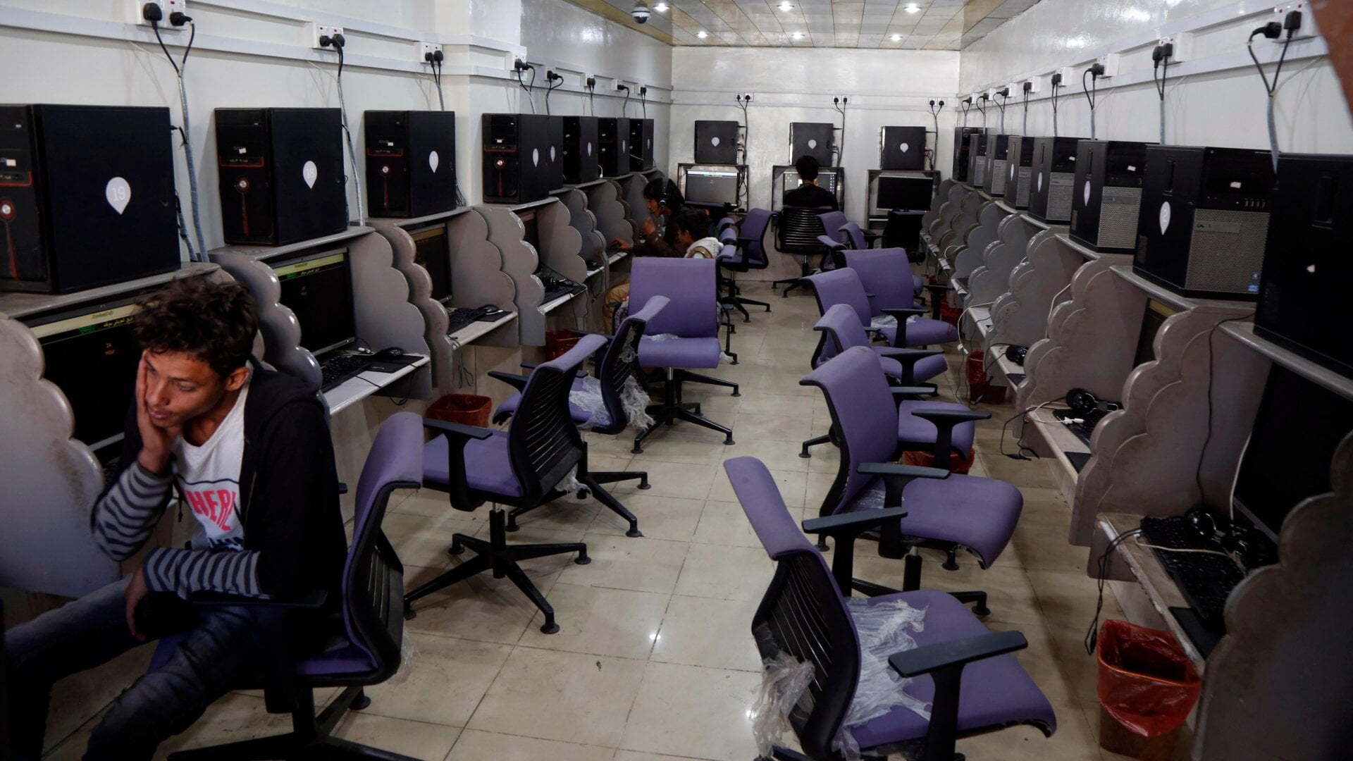 People playing offline games at an internet cafe during a previous nationwide internet outage in Sanaa, Yemen, on Jan 12, 2020.
