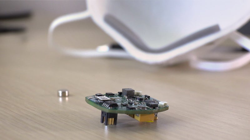 “FaceBit outside of a mask, next to its small battery.”