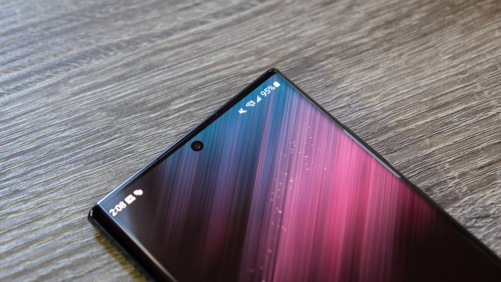 The Galaxy S22 Ultra’s front-facing camera is embedded right into the display. 