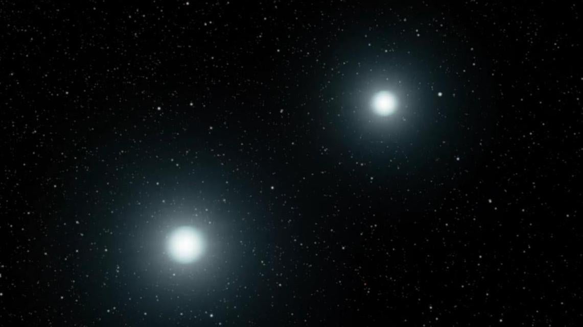 An artist’s impression of two white dwarfs meeting in a merger.