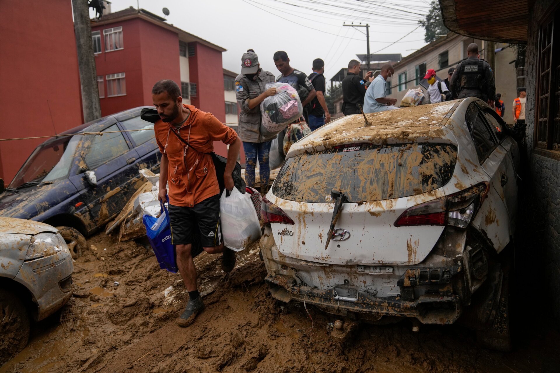 Residents recover belongs from their homes destroyed by mudslides.
