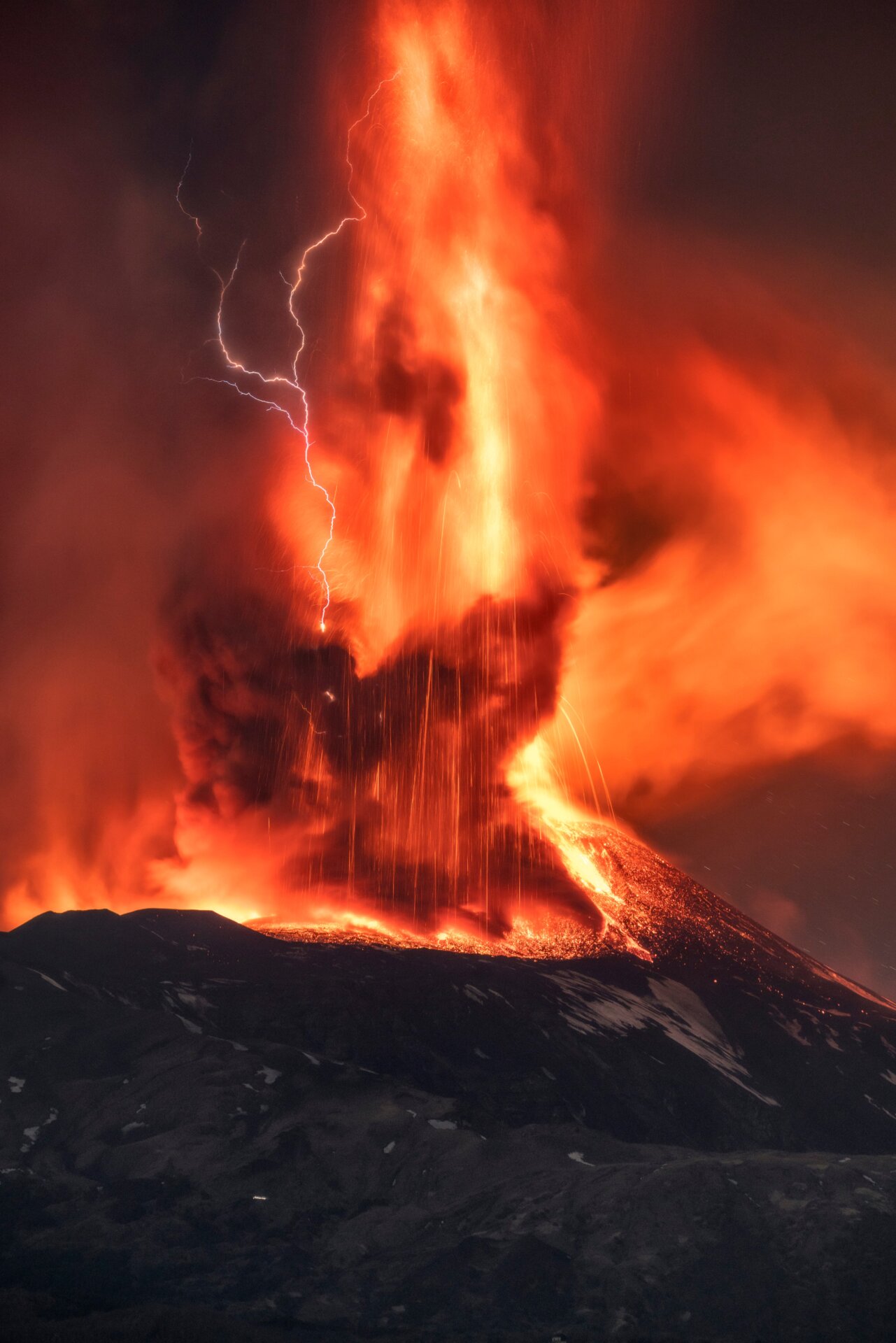 A volcanic thunderstorm over Mount Etna on Sicily, Italy, during an eruption on Friday, Feb. 11, 2022. 