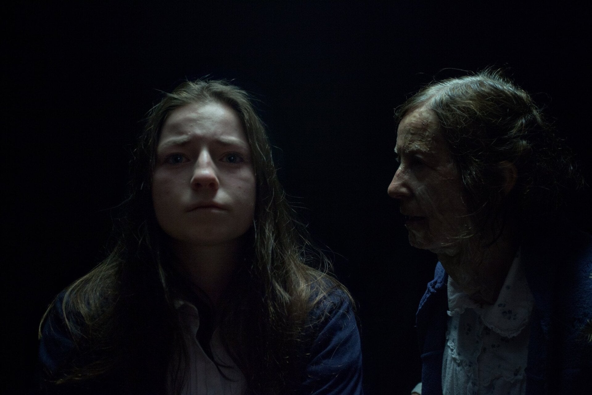 Char and Granny are surrounded by darkness.