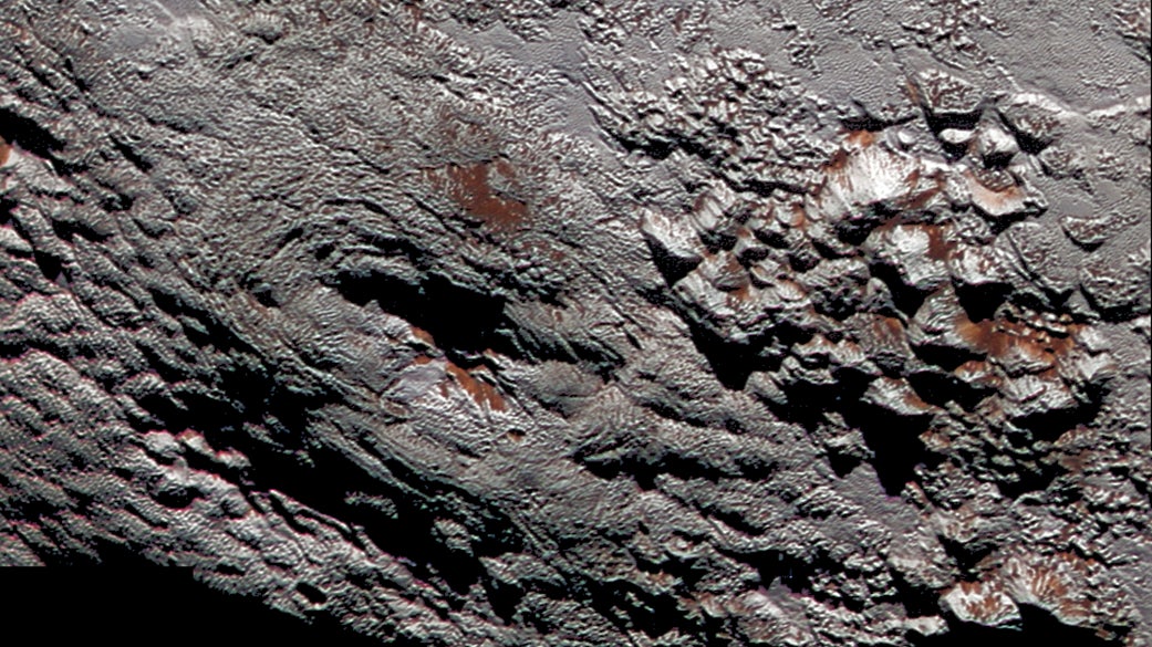 A colorized view of Wright Mons within the cryovolcanic region.
