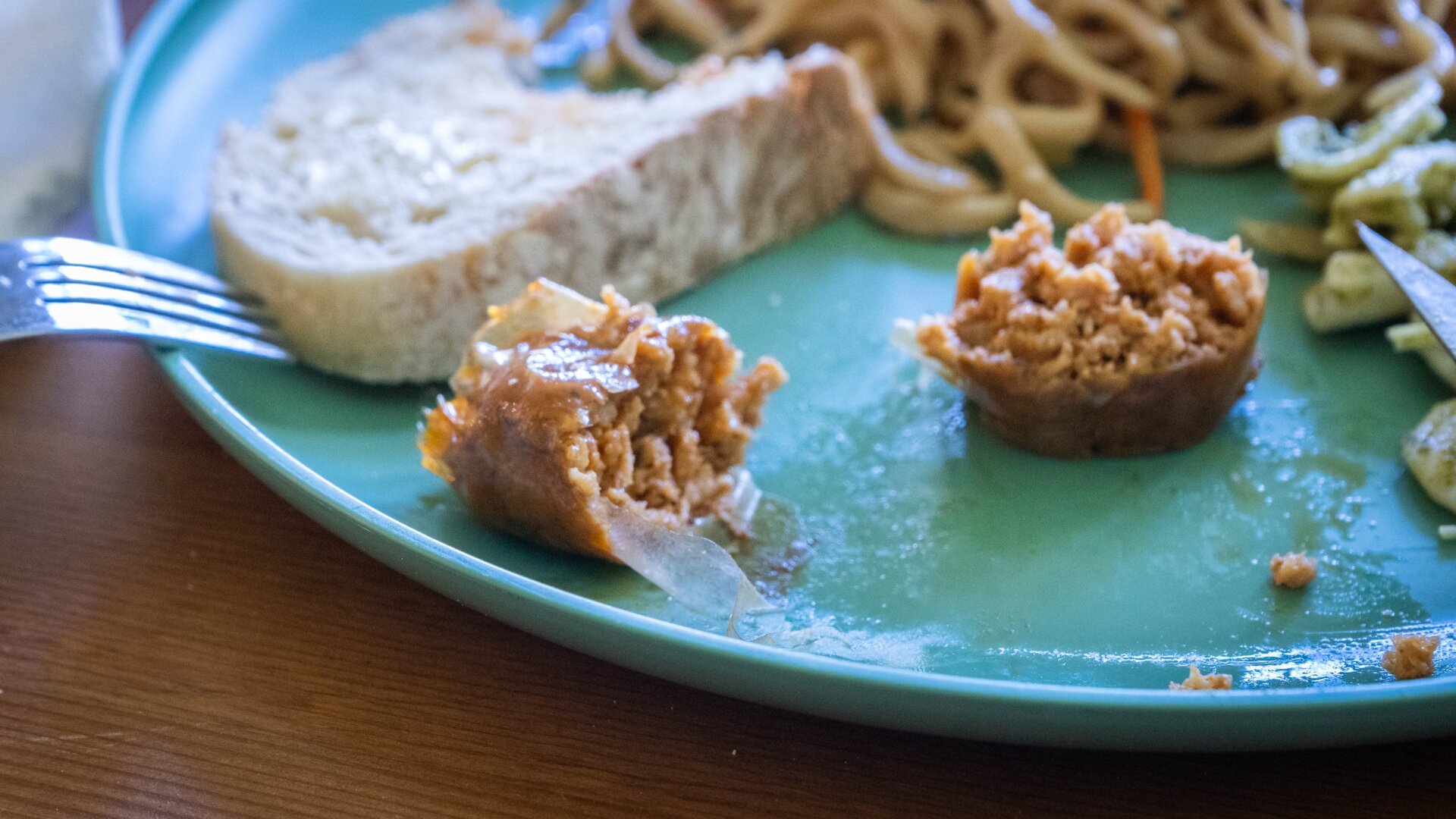 You can see a sliver of the casing on the Impossible Foods sausage link. It’s best cut with a sharp knife.