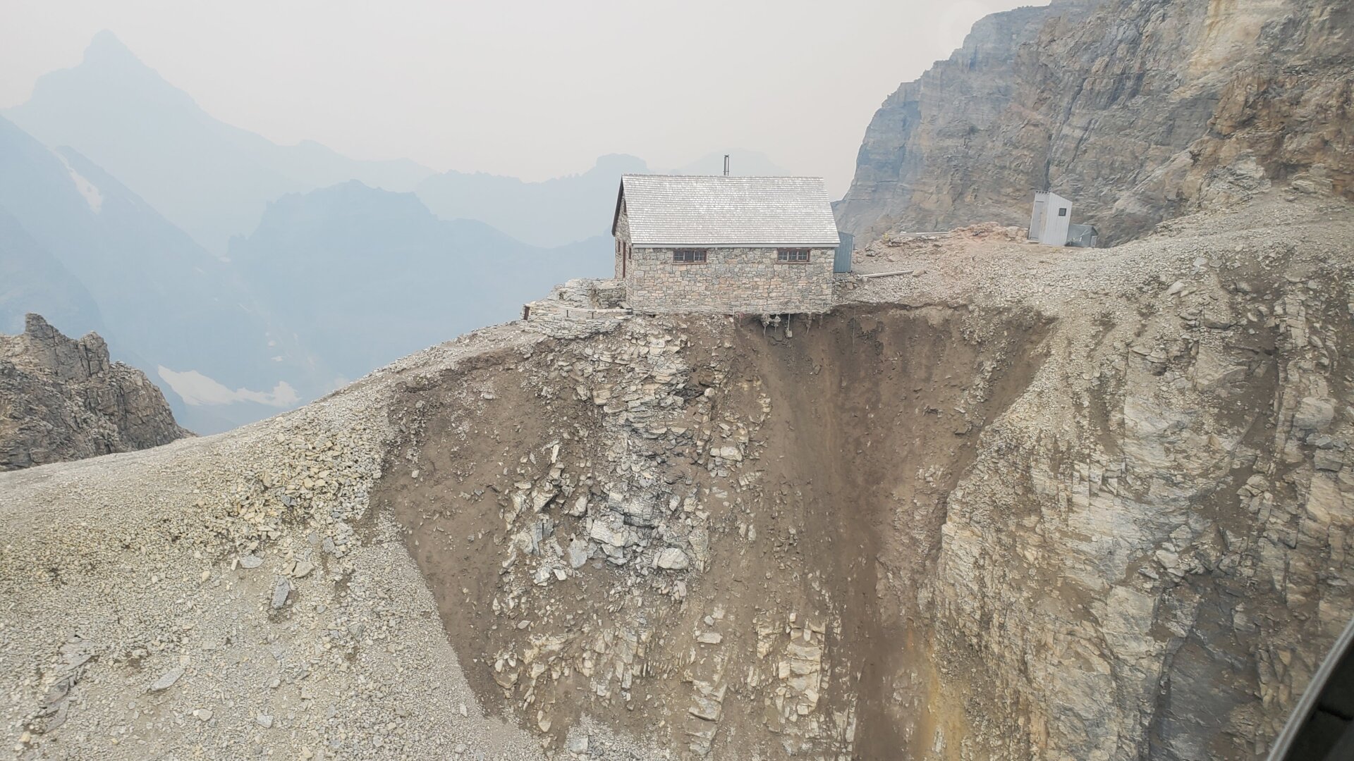 An aerial photograph showing the erosion of one side of the slope.