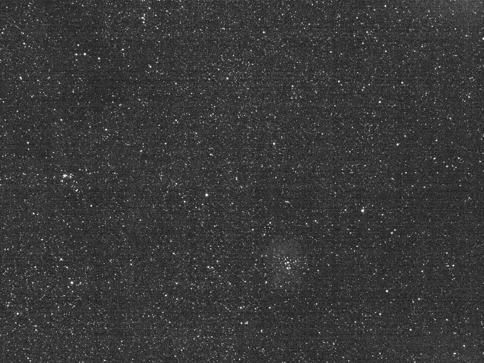 The Rosette Nebula can be seen in the lower right of the center of the frame.