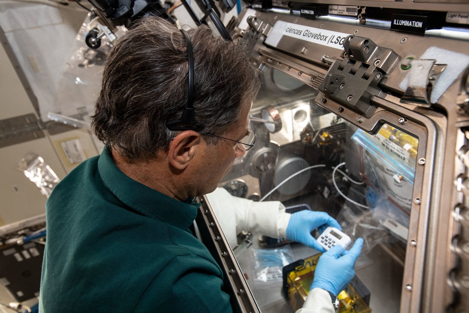 Axiom Space Ax-1 mission specialist Eytan Stibbe performing research on the ISS. 