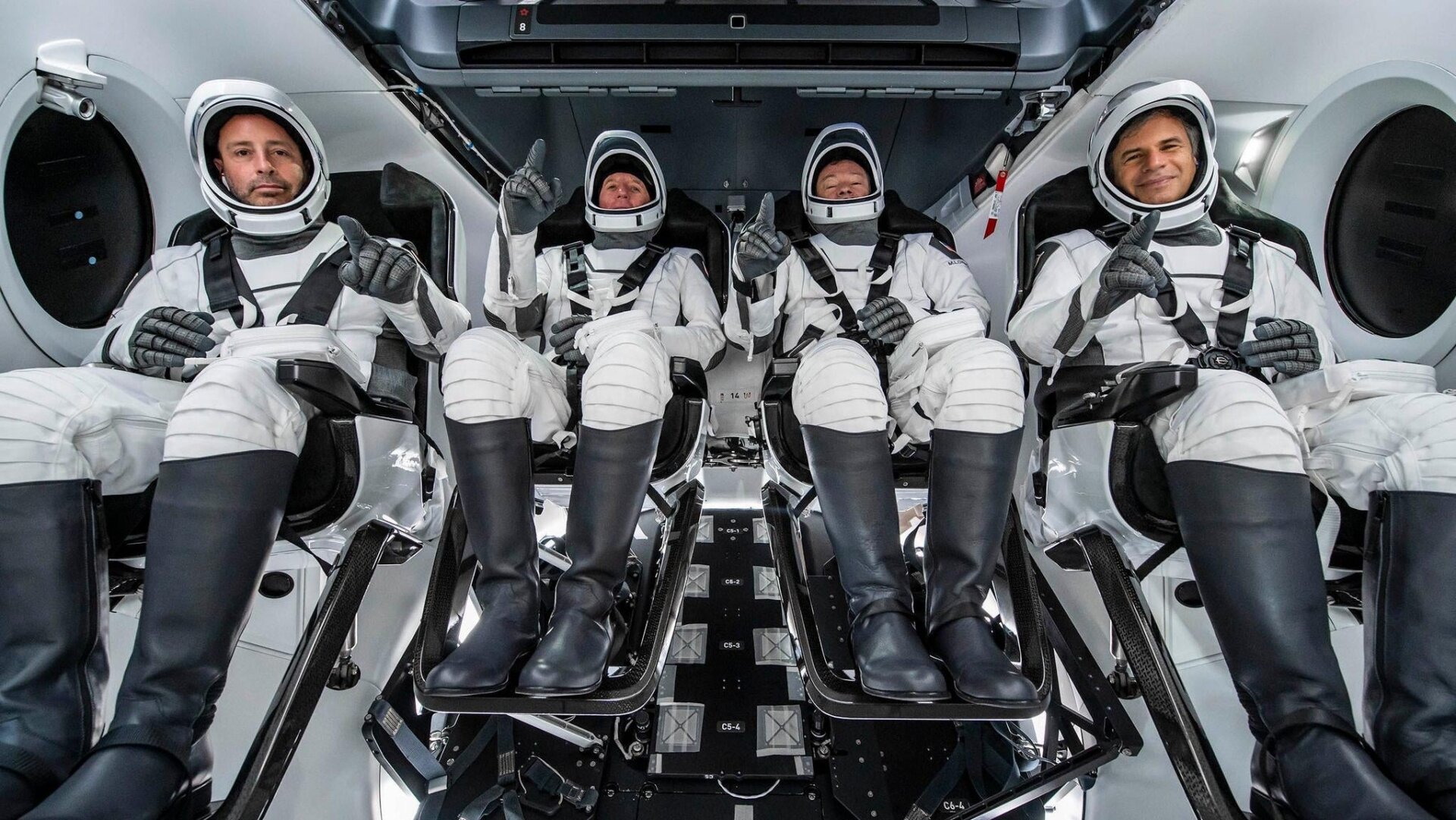 The Ax-1 crew inside a SpaceX Crew Dragon capsule.