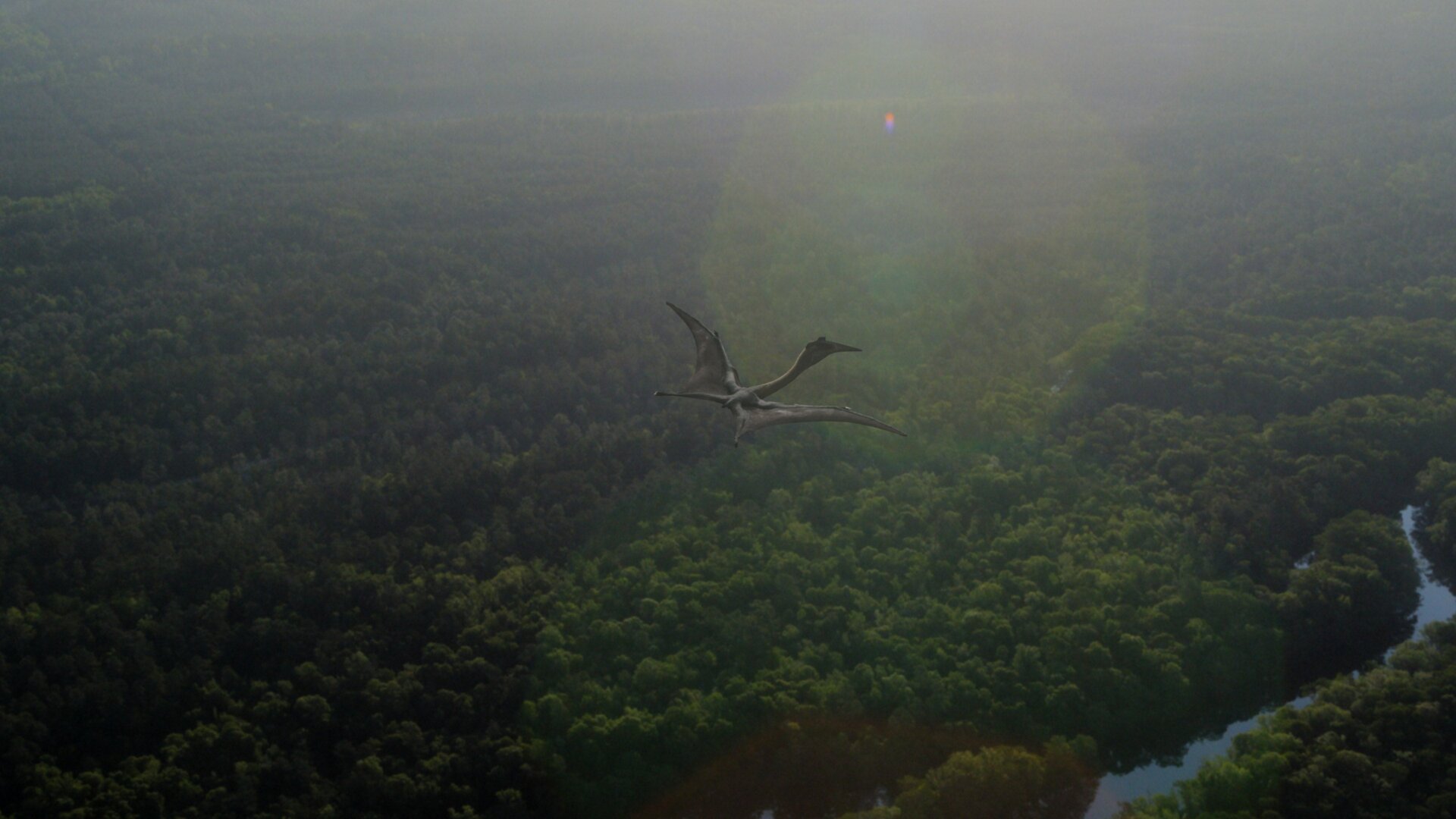 Quetzalcoatlus—the largest-known pterosaur—flies over a forest.
