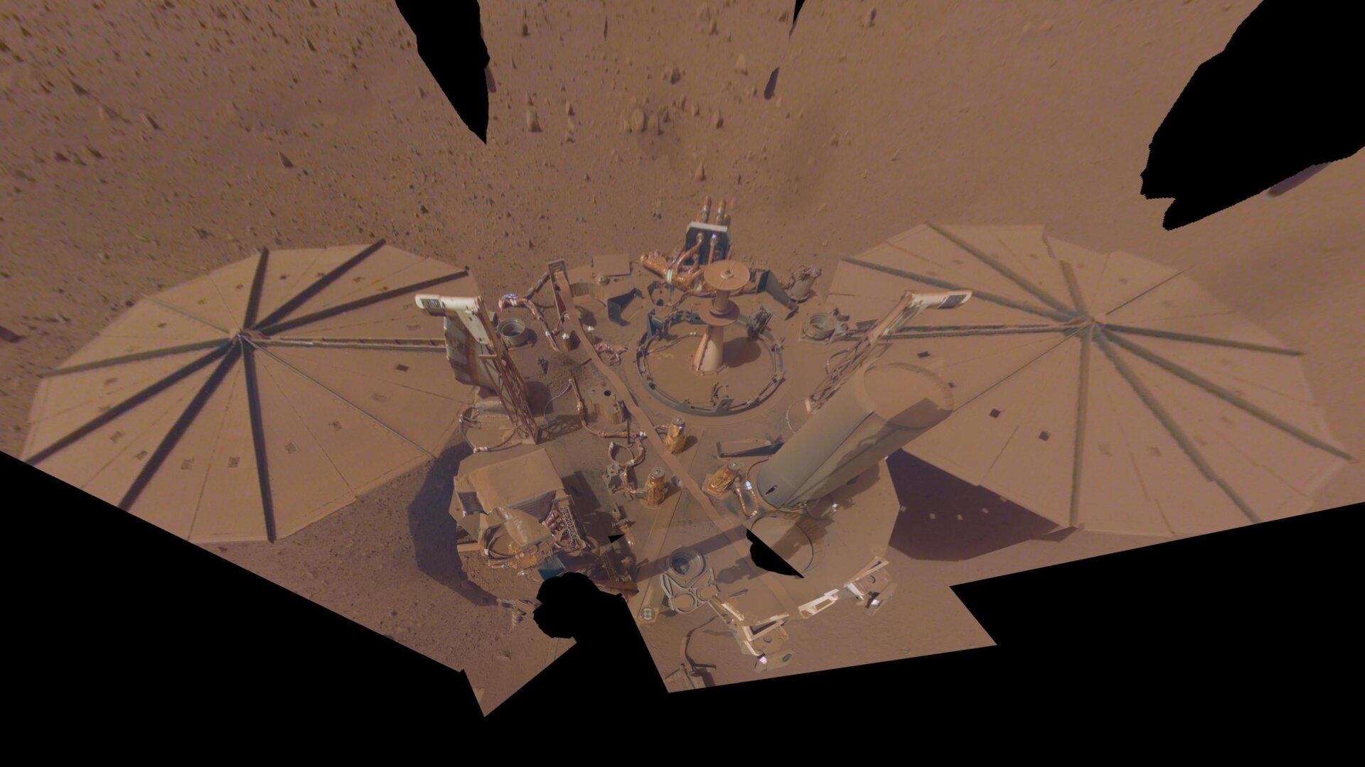 Dust accumulations on NASA’s InSight lander, covering its solar panels.