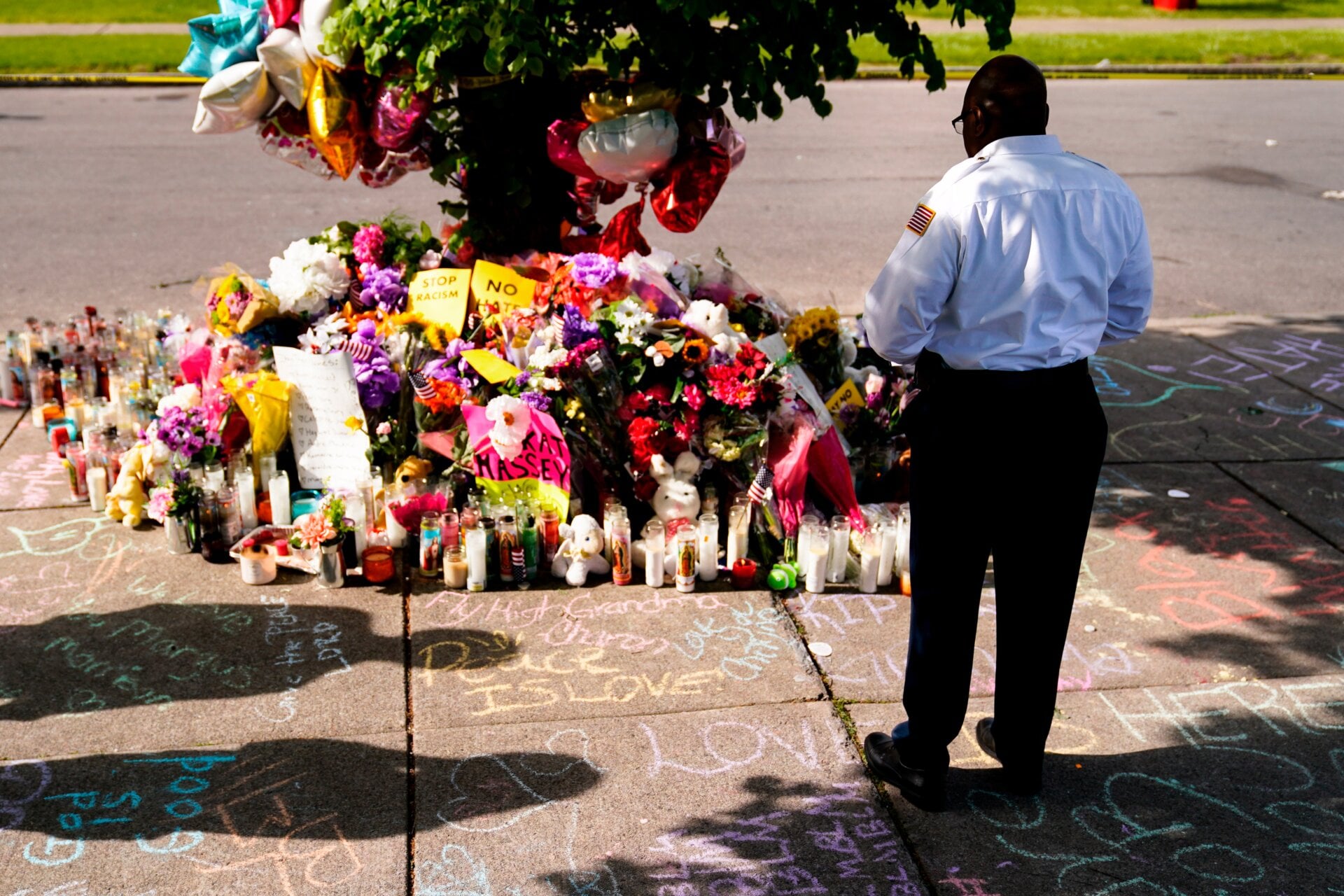 Howard Patton pays his respects at the scene of the Buffalo shooting. Memorials continued for days after the massacre on May 14.