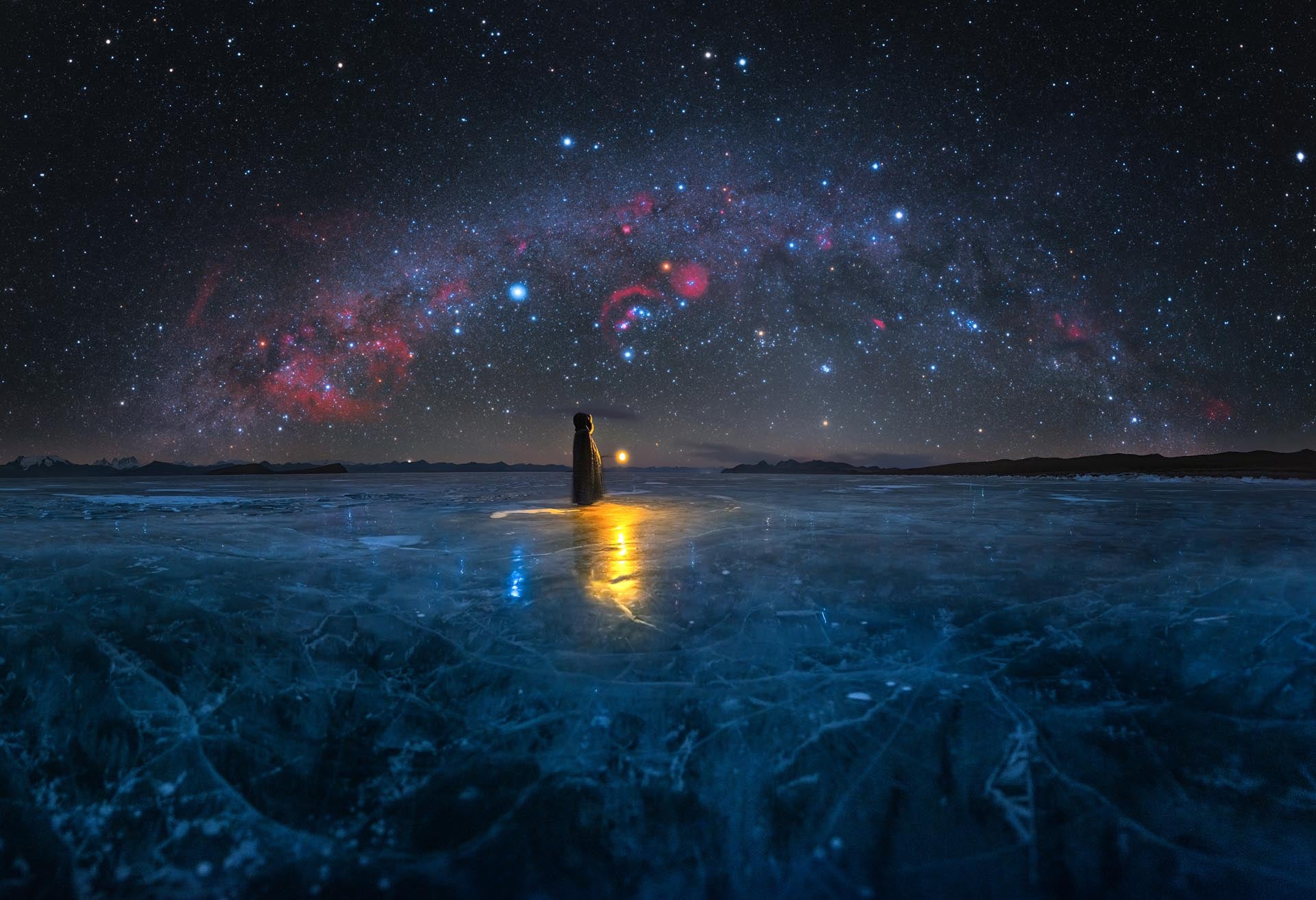 The Milky Way arch above a frozen lake in Tibet.