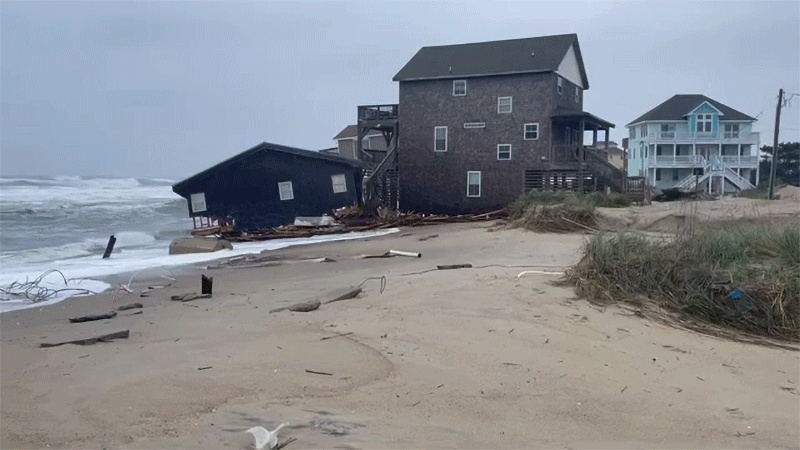 Waves continued to batter the first house after it fell. 