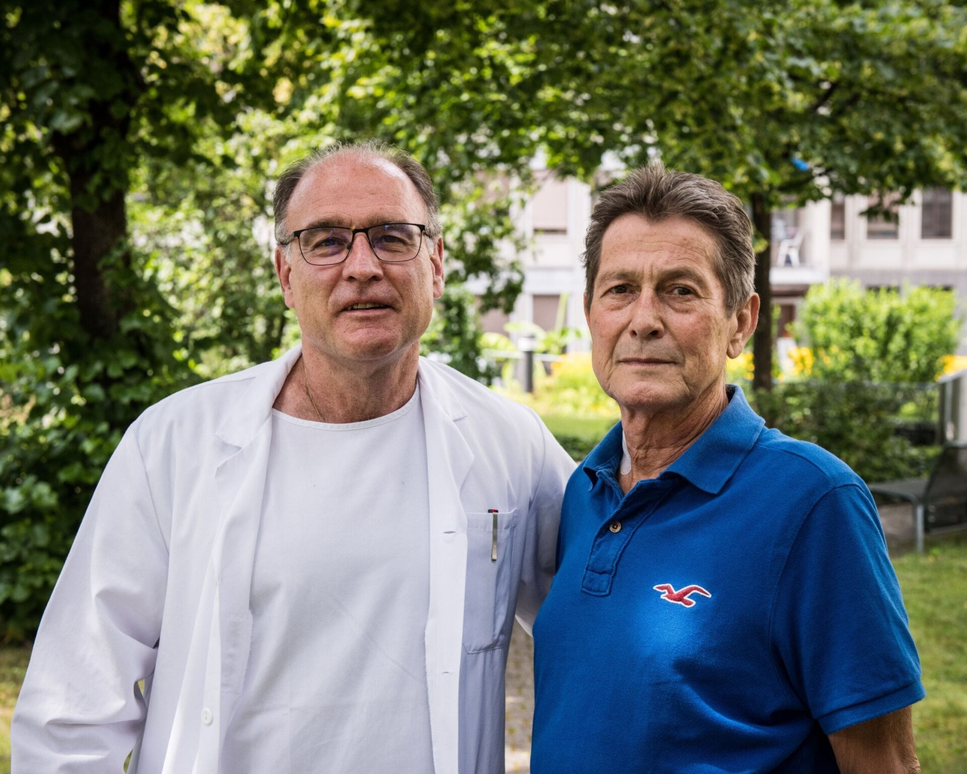 Surgeon Pierre-Alain Calvien (left) and the patient (right). 