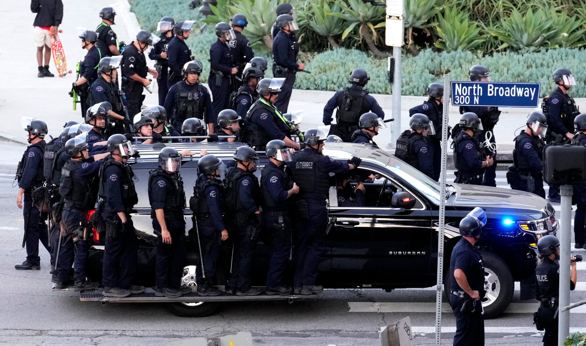  Activists protest along Broadway over the 110 freeway as LAPD blocks  the freeway access in Los  Angeles on Friday, June 24, 2022. 