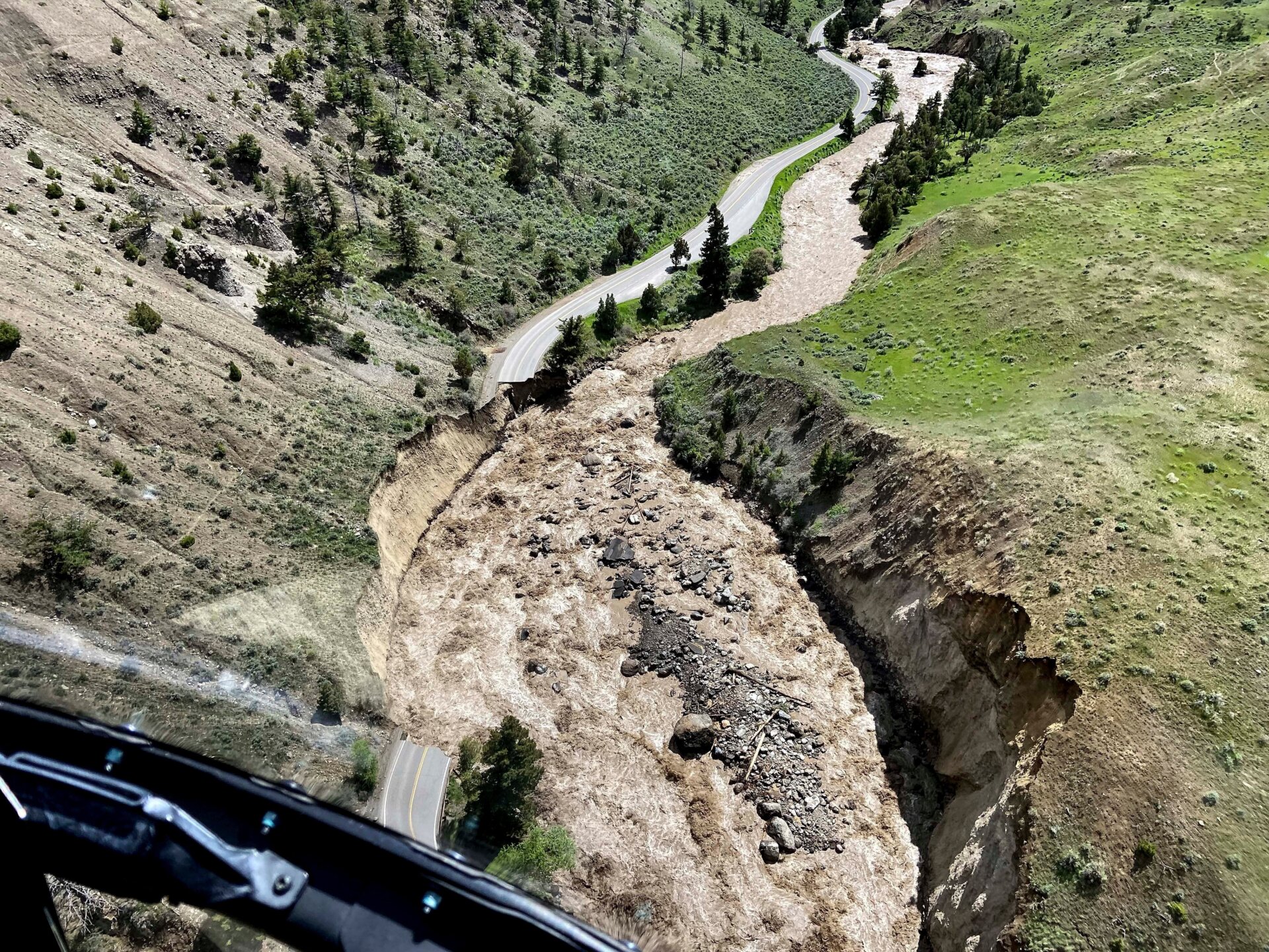 From helicopters, National Parks staff were able to survey and photograph just some of the damage that has already emerged from the flooding. This road leads from the town of Gardiner to Yellowstone’s northern entrance. It will likely be closed for months for rebuilding.