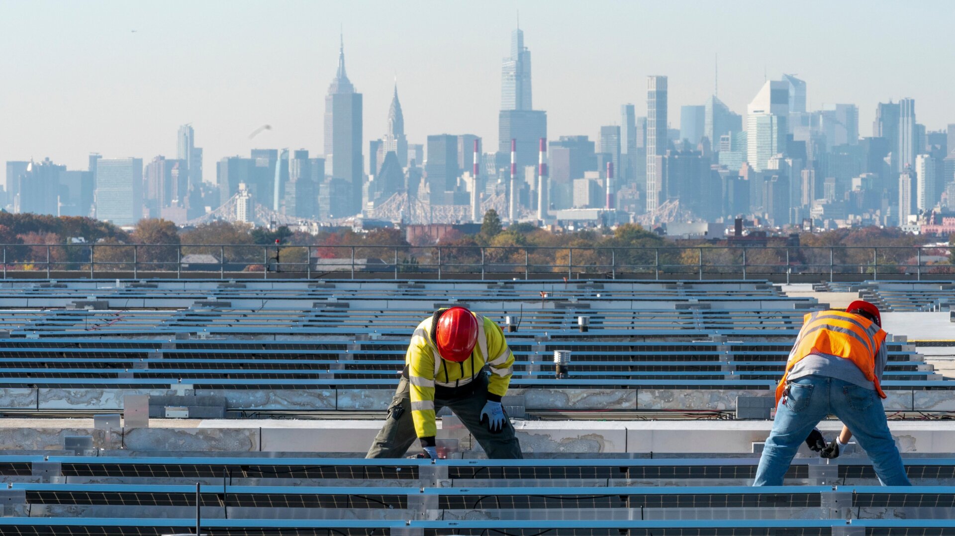 IBEW Local 3 workers install a solar panel on top of LaGuardia Airport in New York City.