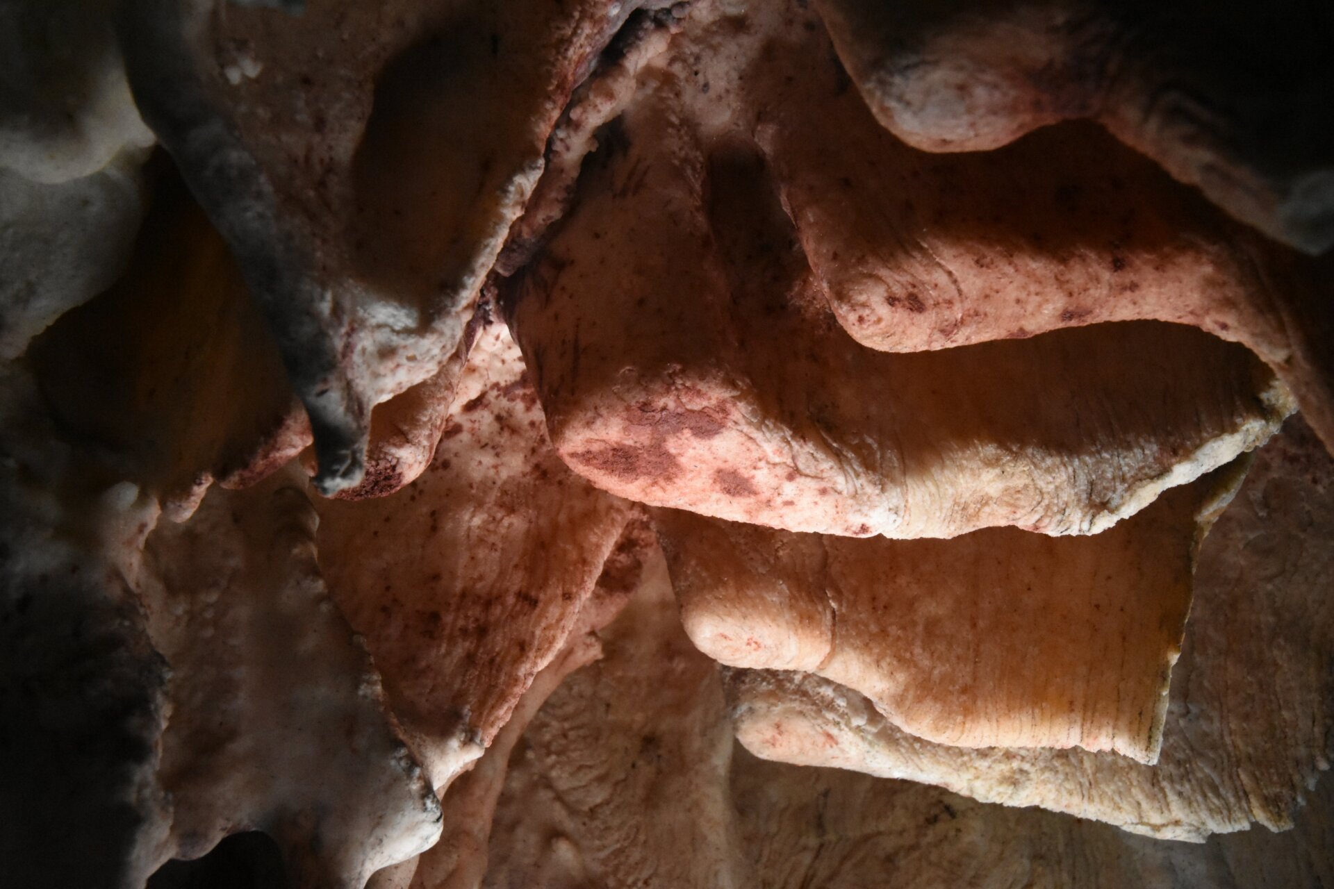 Clumps of red ochre on the cave’s stalactites.