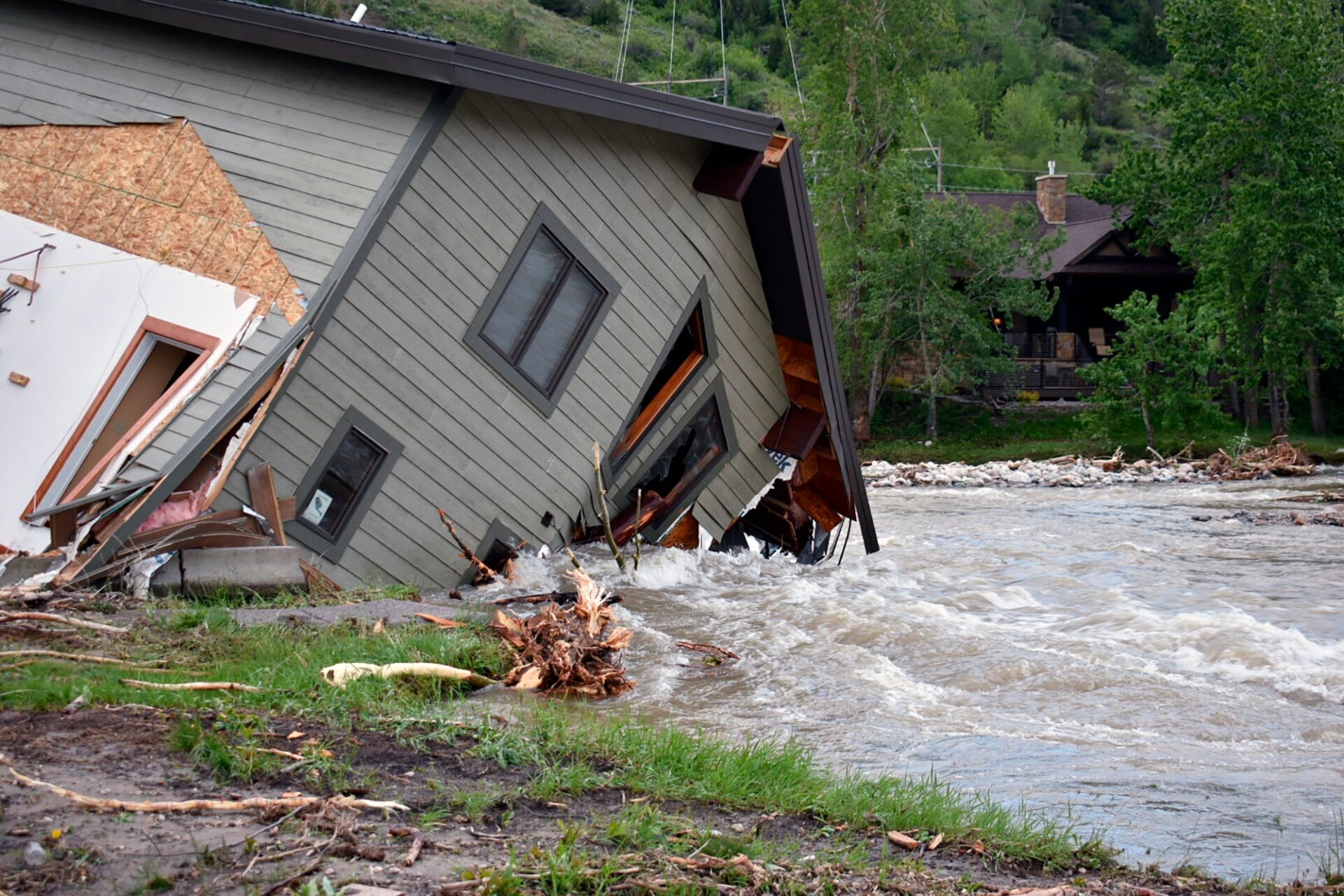 Other structures, including this house in Red Lodge, Montana, were pulled down by rushing floodwaters as well. 