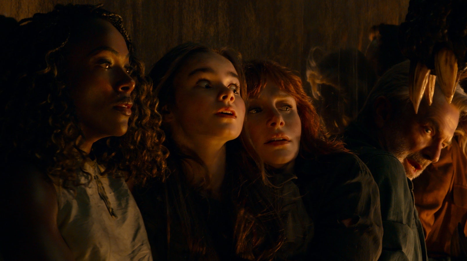 Kayla, Maisie, and Claire avoid a dino.