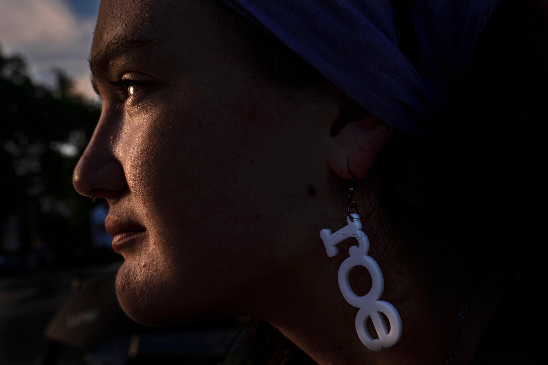 Abortion rights supporter Lilly, who declined to provide a last name, watches the sunset near the Supreme Court on June 28, 2022 in Washington, DC.