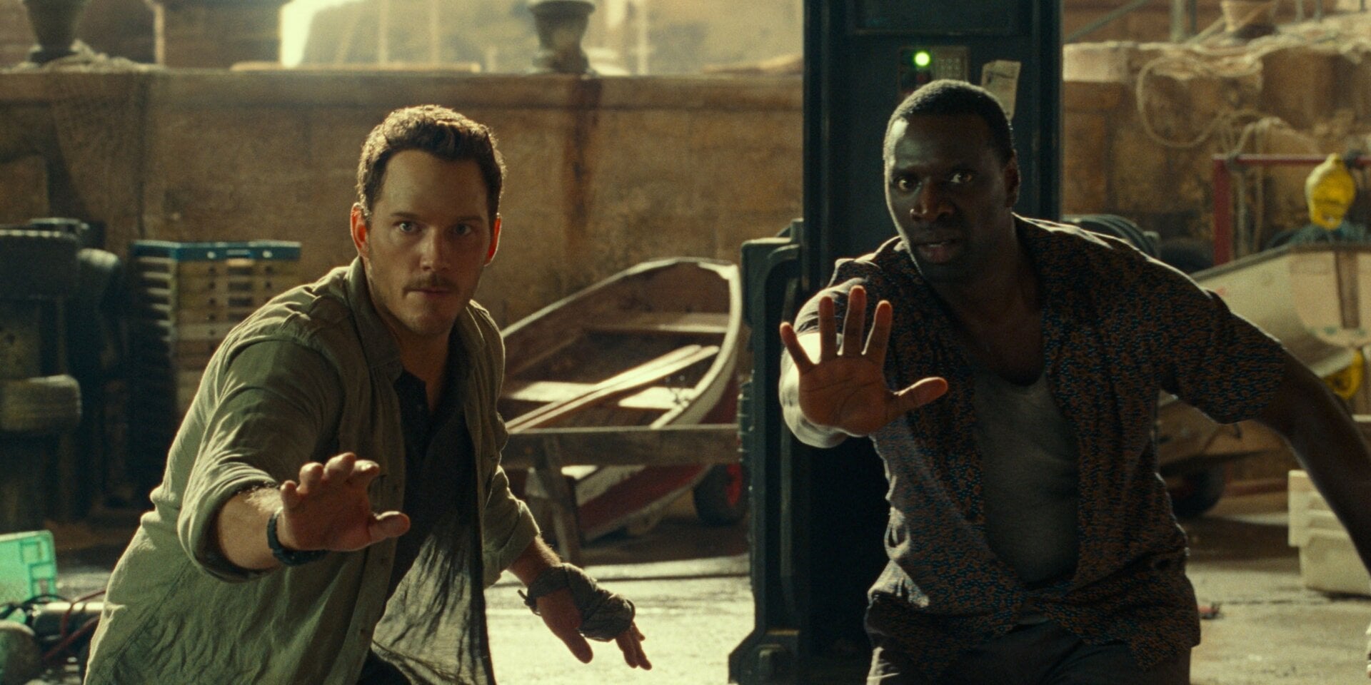 Owen and Barry Sembene (Omar Sy) do the hand thing.