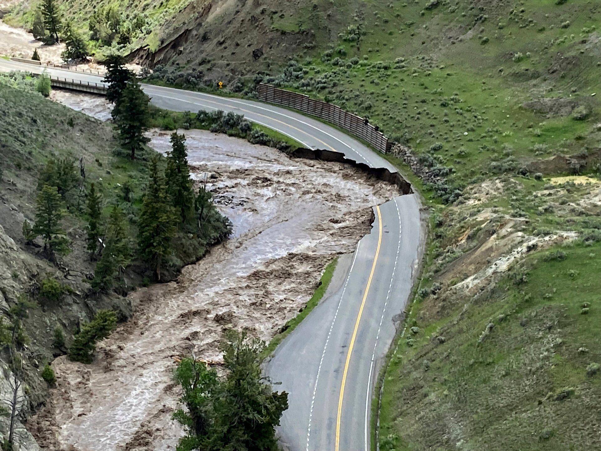 The flooding has rendered large sections of road, both inside and outside of Yellowstone National Park, impassable—rapidly eroding and washing away entire sections.