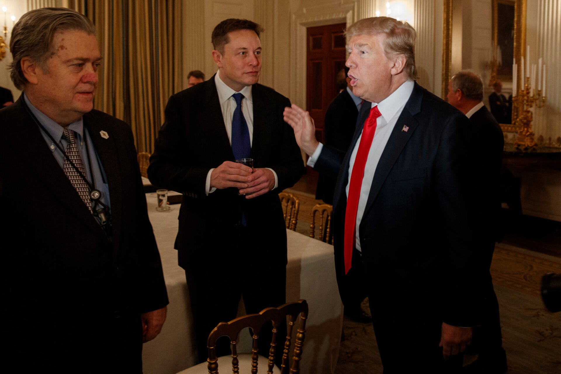 Elon Musk meets with President Donald Trump and White House chief strategist Steve Bannon in the State Dining Room of the White House in  Washington on Feb. 3, 2017.