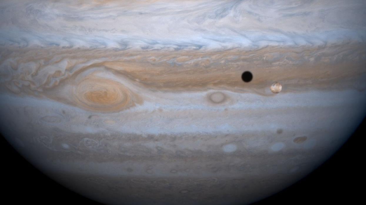 A Cassini image of Io passing in front of Jupiter. 