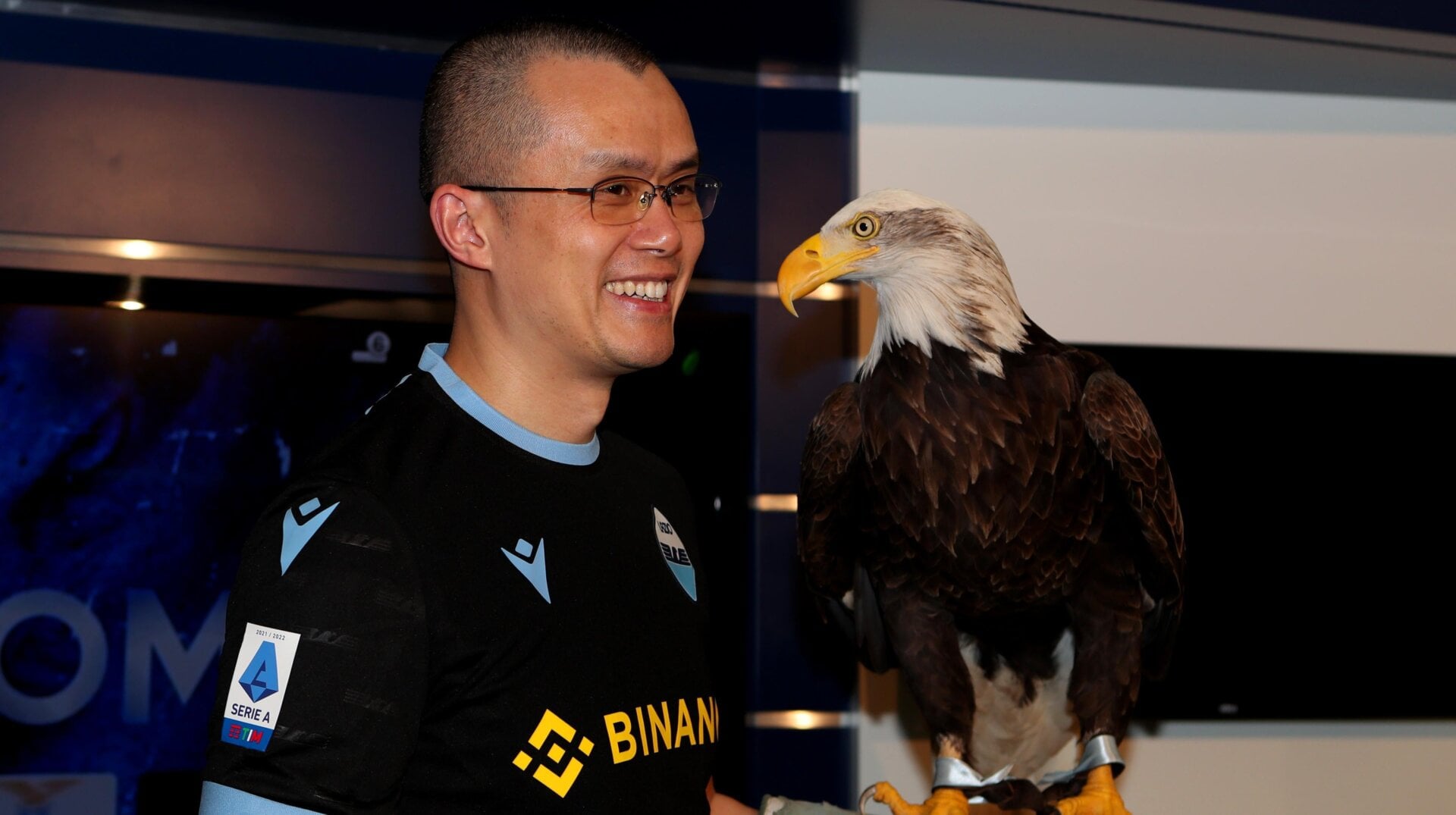 Binance CEO Changpeng Zhao poses with SS Lazio eagle mascotte Olimpia during the visit at Formello Sport centre in Rome, Italy.