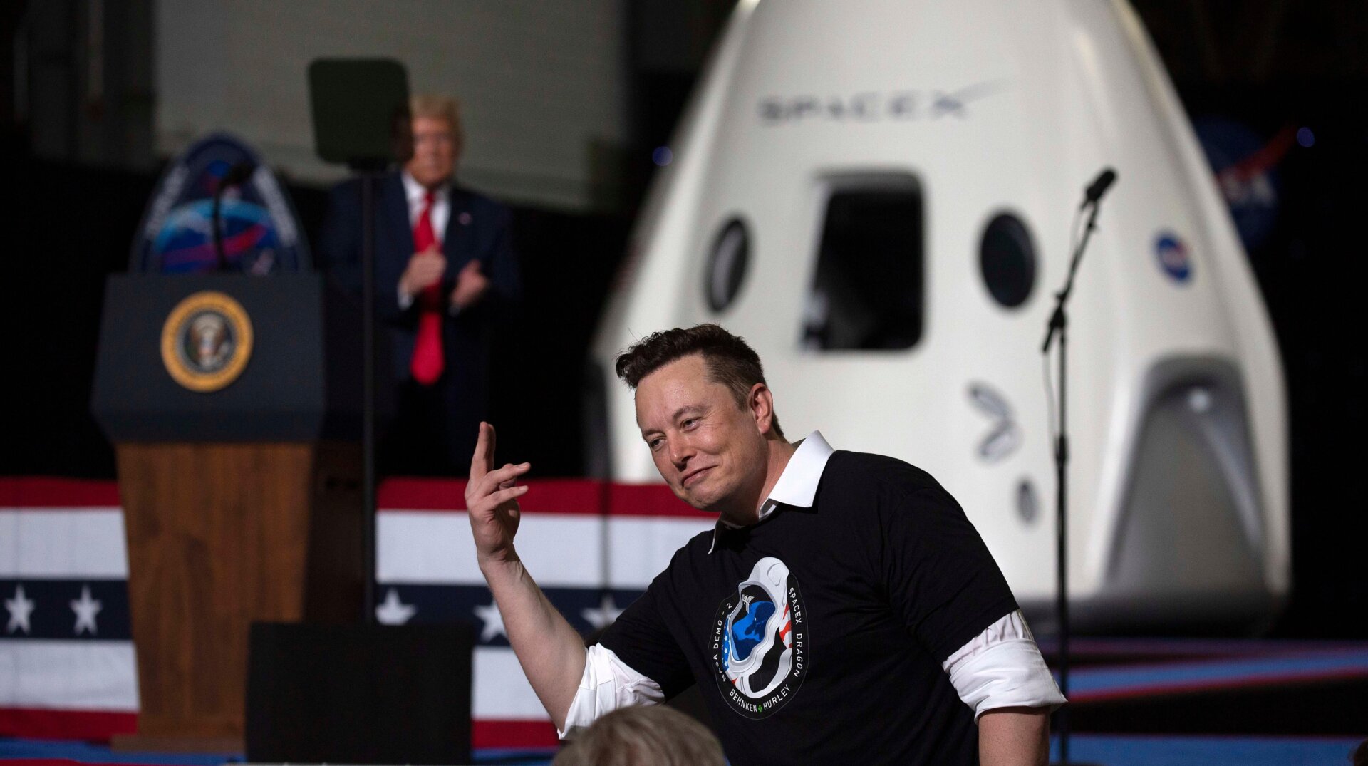 U.S. President Donald Trump acknowledges SpaceX founder Elon Musk (R) after the successful launch of the SpaceX Falcon 9 rocket with the manned Crew Dragon spacecraft