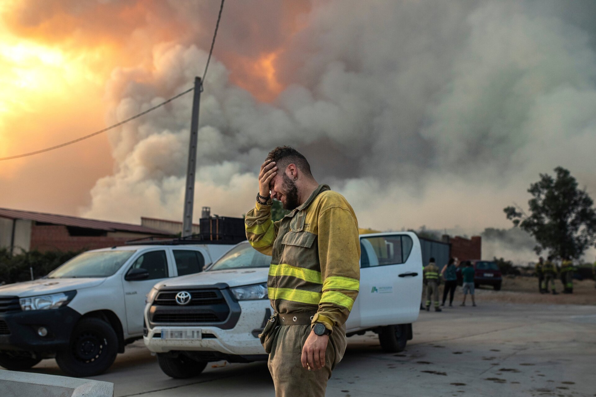 A firefighter cries while fighting a blaze in the Losacio area of Spain on July 17, 2022.