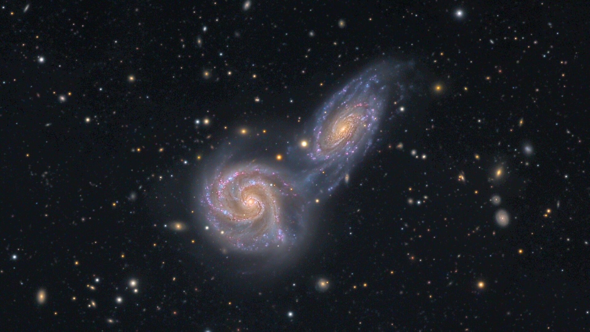 Two galaxies spin together.