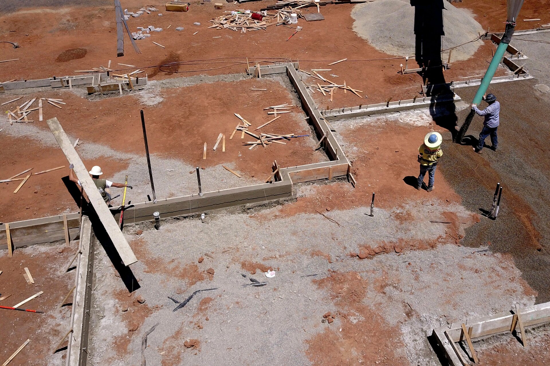 Builders work to lay a foundation for a new home in July 2019, in Paradise, Calif. The neighborhood was destroyed in the 2018 Camp Fire.