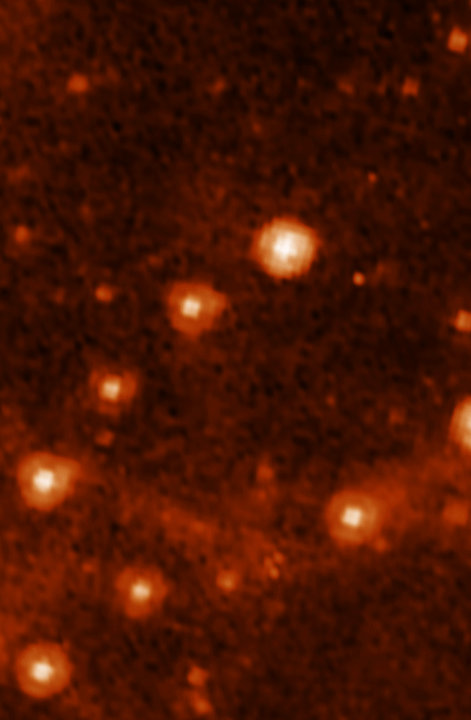 A section of the Large Magellanic Cloud seen by Spitzer (fuzzier) versus Webb (sharper).