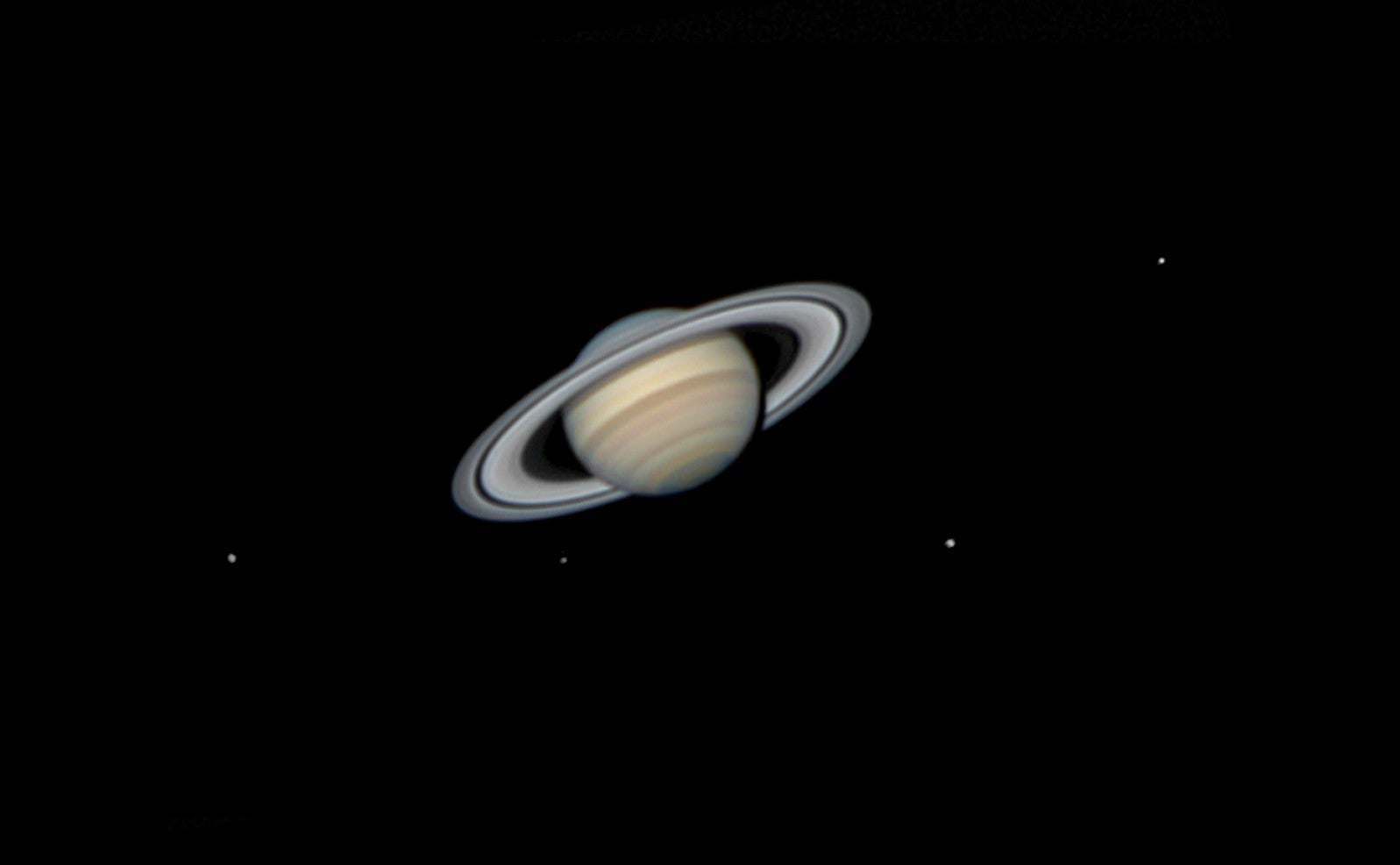 Saturn and four of its moons.
