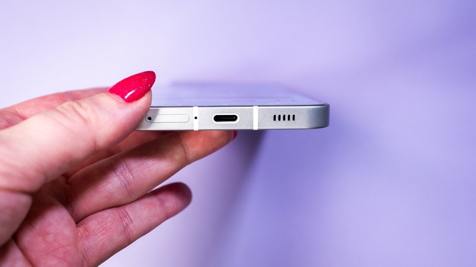 The bottom side-view of the Nothing Phone (1). 