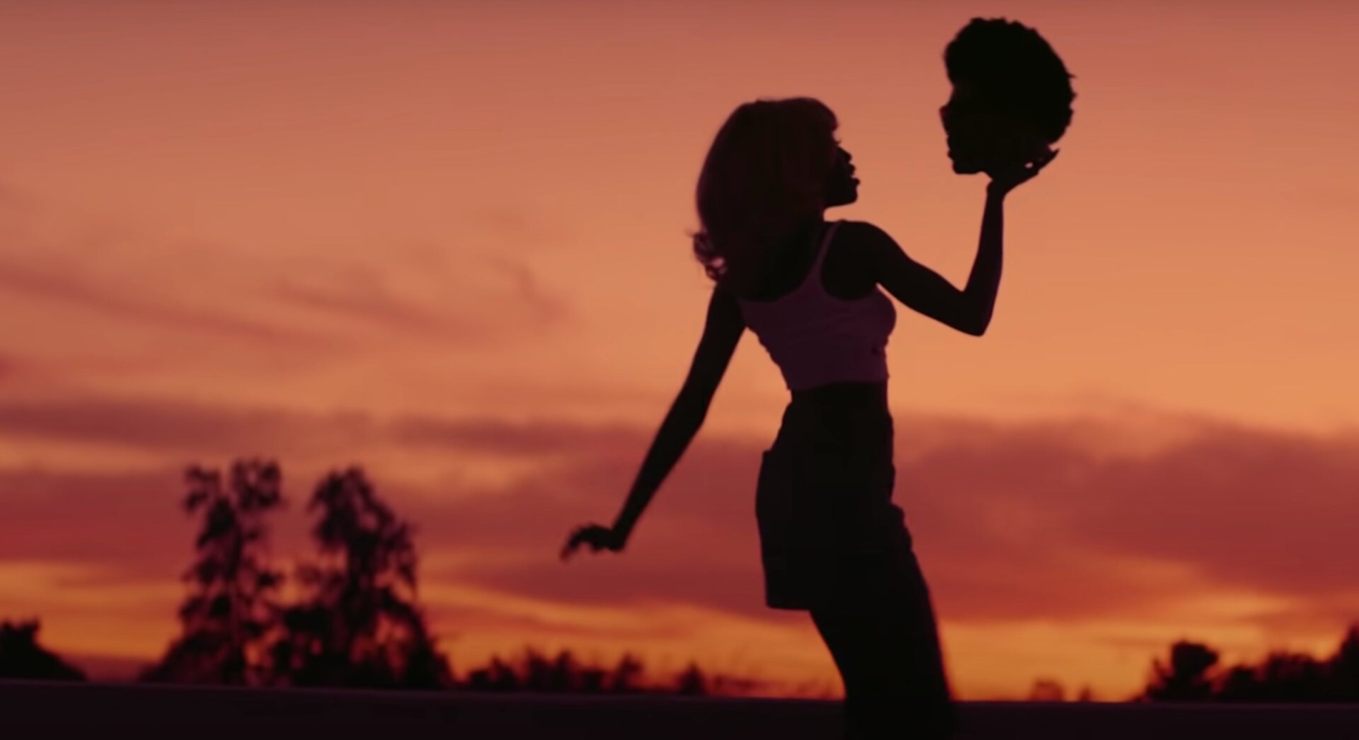 Yes, she’s holding the Weeknd’s severed head.