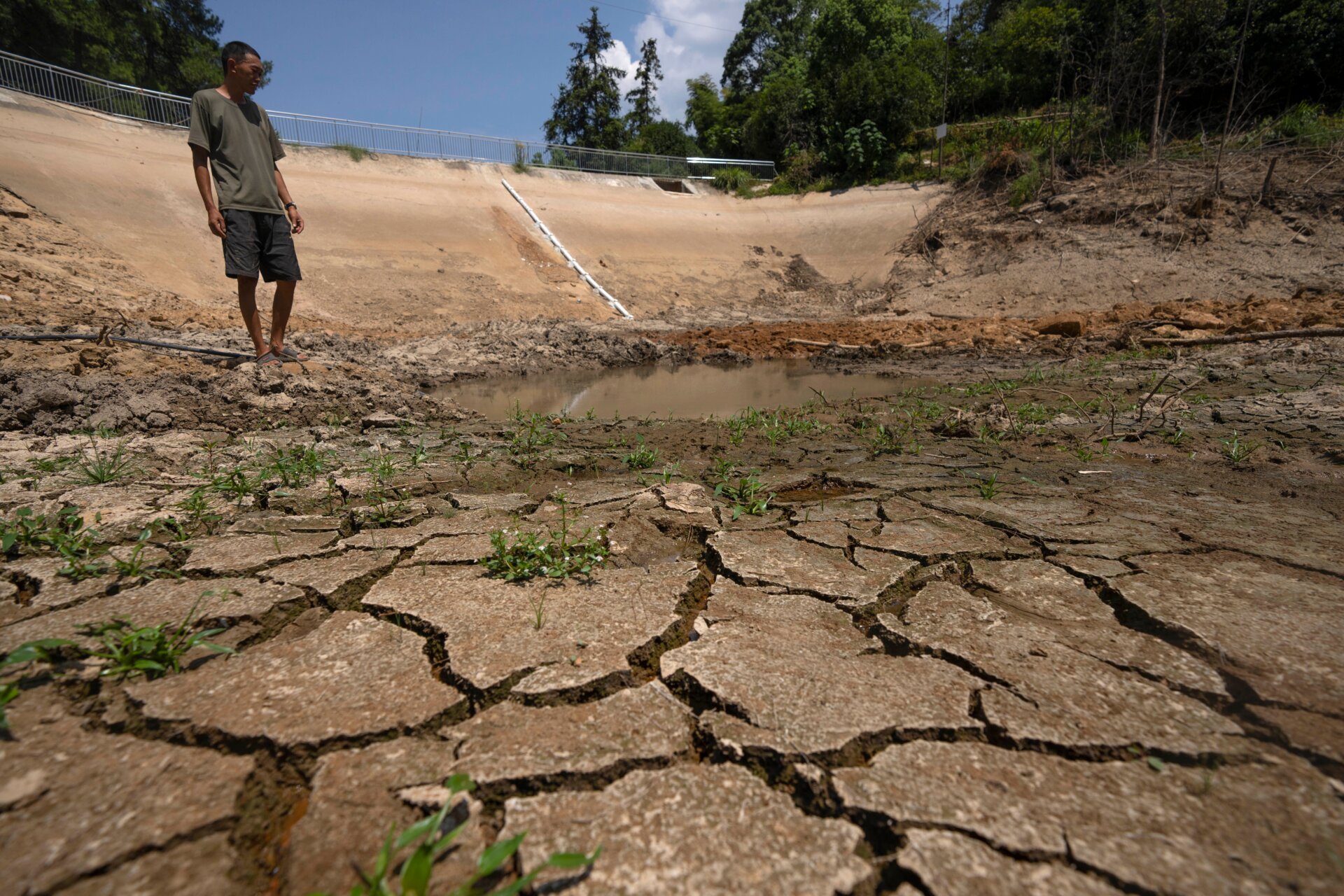 Gan Bingdong at his community’s dried-up reservoir.