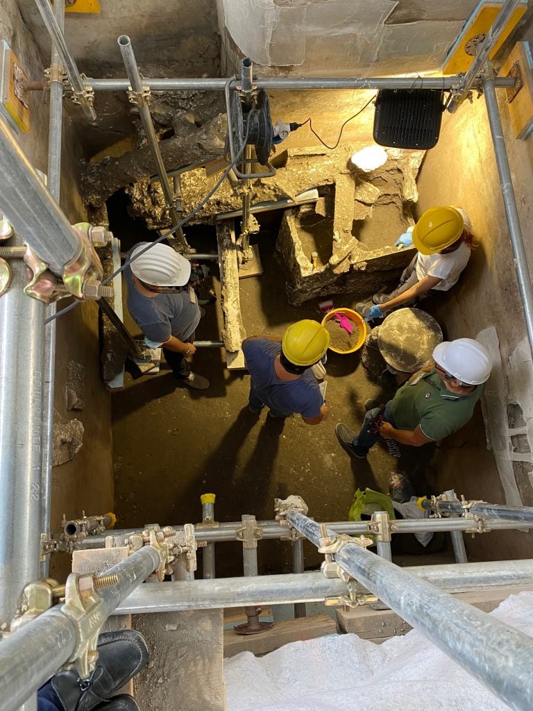 Archaeologists work in the room in the House of the Lararium.