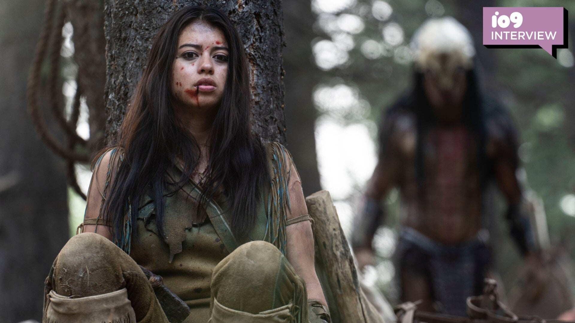 Amber Midthunder as Naru hides from the Predator in Prey.