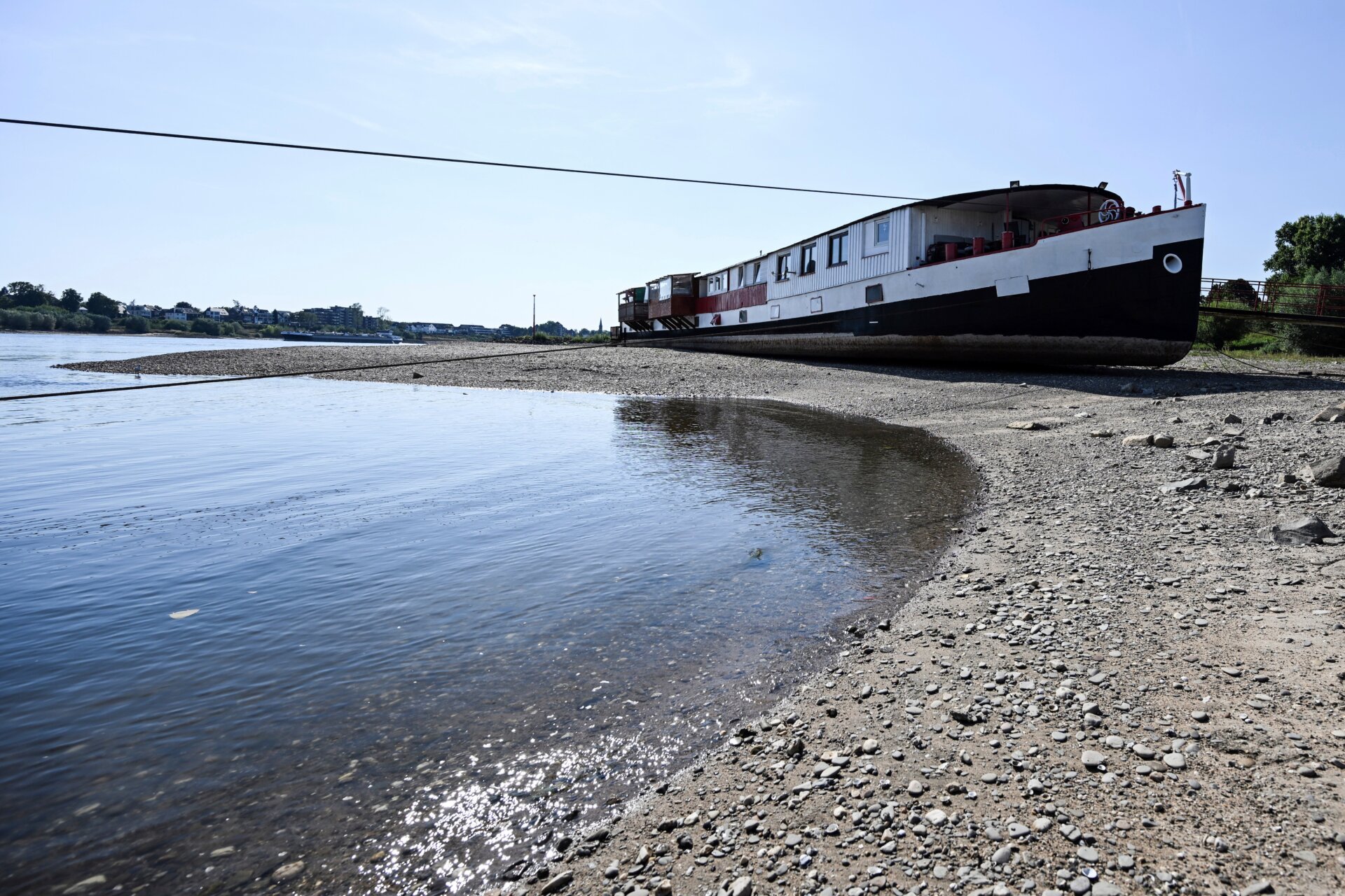 A ship lies dry between the groynes on the Rhine in Germany on August 11, 2022. 