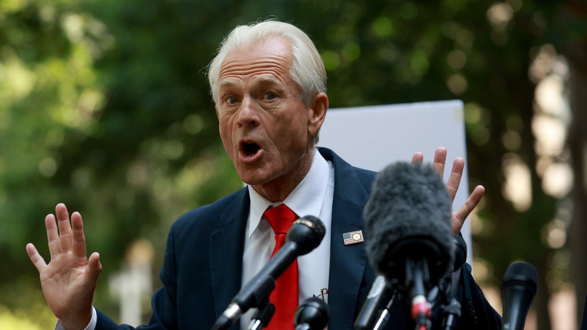 Trump apologist Peter Navarro speaks with the media as he leaves the Prettyman U.S. Courthouse on June 17, 2022 in Washington, DC.