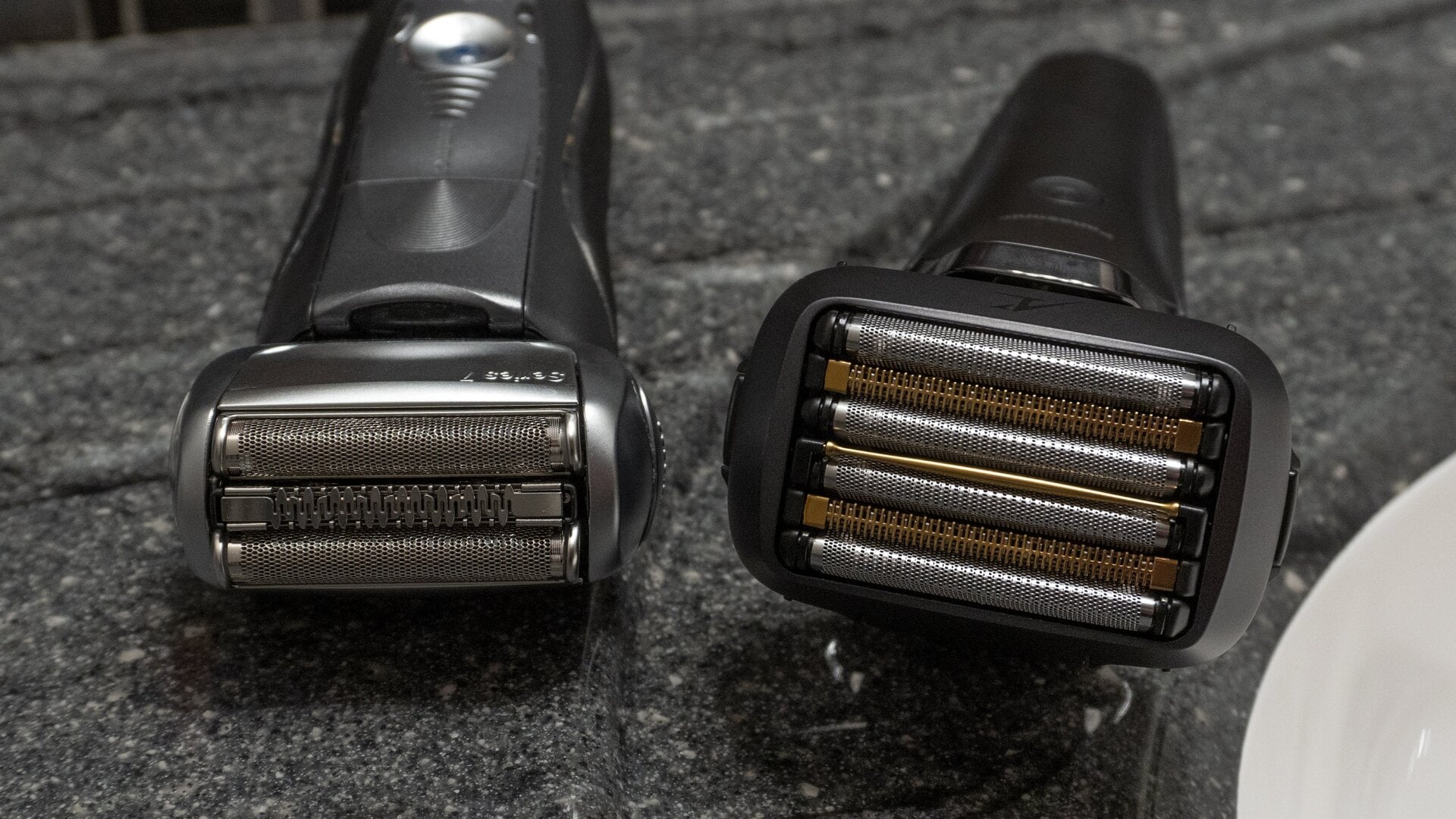 The Panasonic Arc6 razor (right) next to a Braun Series 7 razor (left).