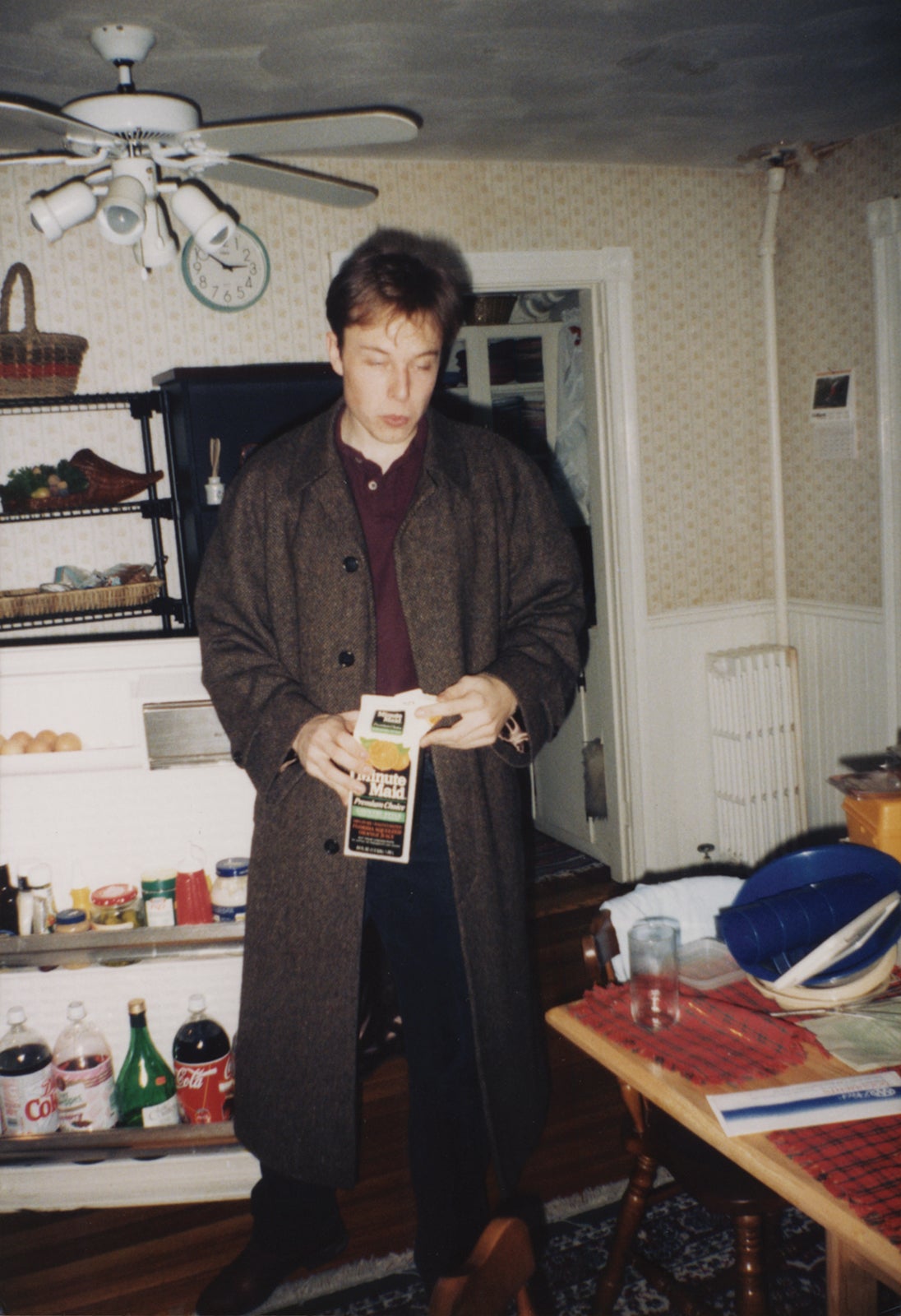 Musk in 1995 in front of an open refrigerator, with orange juice. 