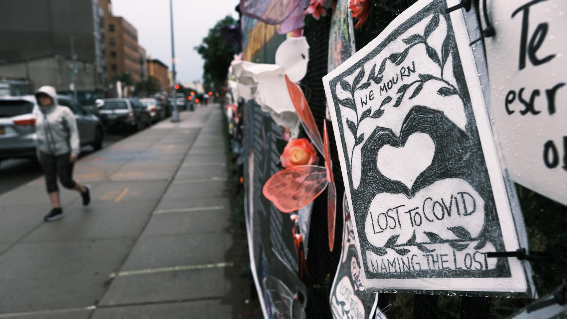 Memorials hang from the front gate of Greenwood Cemetery during an event and procession organized by Naming the Lost Memorials to remember and celebrate the lives of those killed by the covid-19 pandemic on June 8, 2021 in New York City.